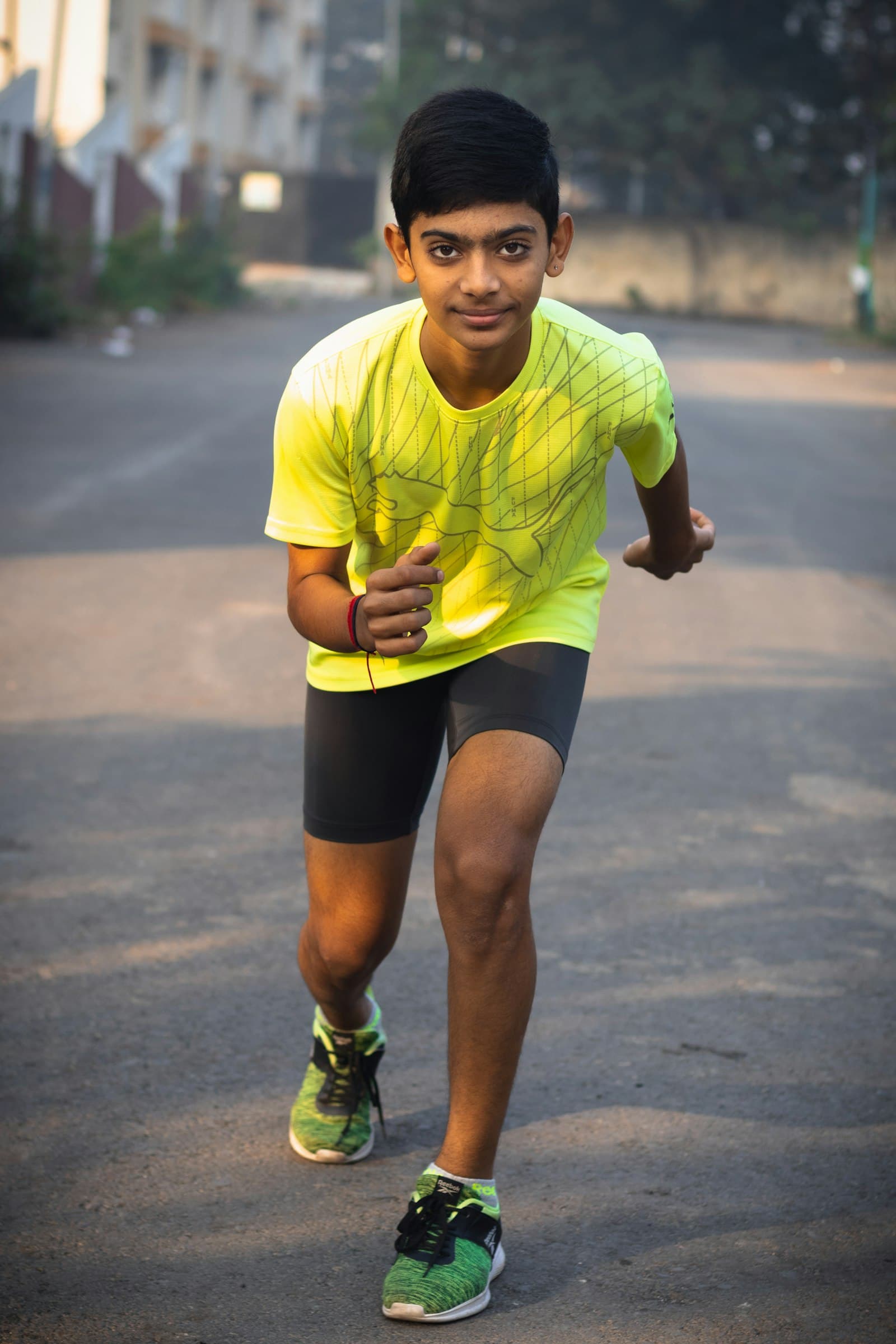 A young athlete performing a return-to-sport drill on a field