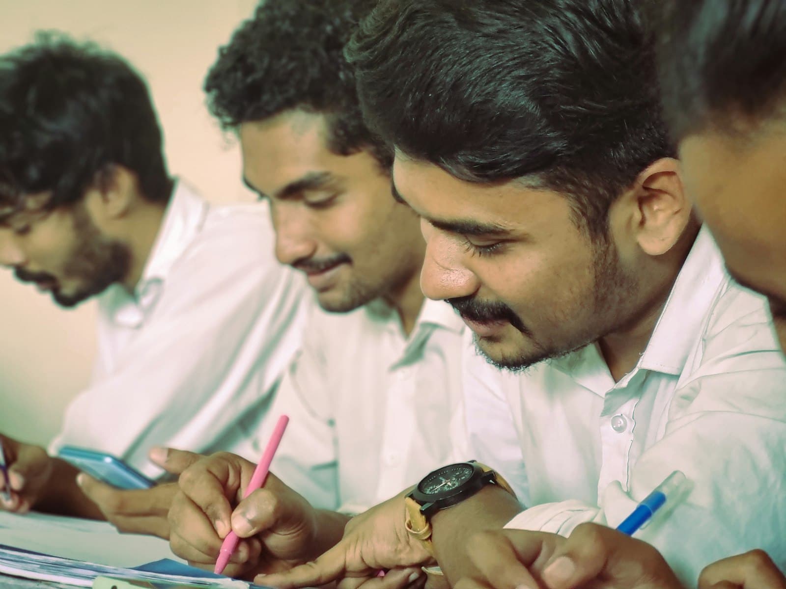Physiotherapy students practising an assessment technique in a workshop