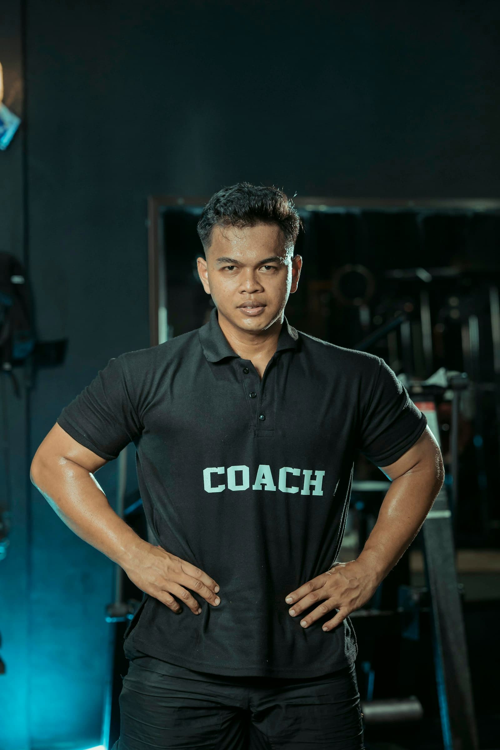 A fitness trainer and physiotherapist discussing an athlete's progression